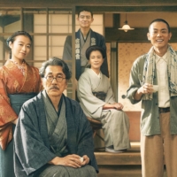 A dedicated family man (Koji Yakusho, second from left) supports the dreams of his son, Kenji Miyazawa (Masaki Suda, second from right), who goes on to become a famous writer in “Father of the Milky Way Railroad.” | © 2022 “FATHER OF THE MILKY WAY RAILROAD” SEISAKU IINKAI

