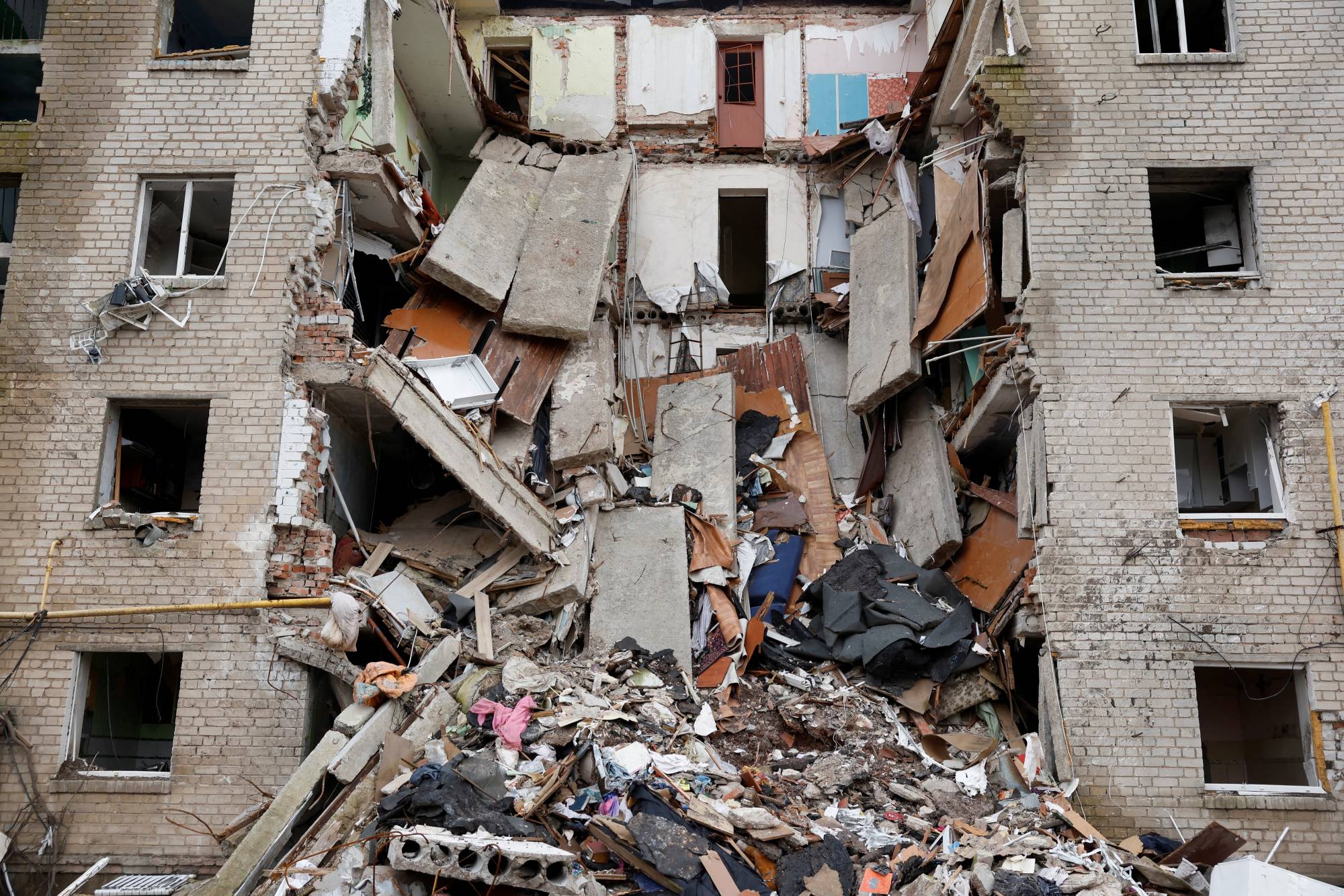 An apartment block destroyed by a missile strike in the city of Bakhmut, in Ukraine's Donbas region, on Jan. 5. | REUTERS