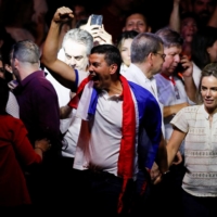 Paraguayan presidential candidate Santiago Pena from the ruling Colorado Party reacts at the party headquarters after he and his running mate, Pedro Alliana, won Paraguay\'s presidential race, according to a preliminary official count, in Asuncion, Paraguay, on Sunday. | REUTERS