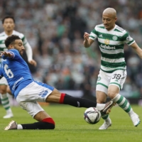 Celtic\'s Daizen Maeda (right) and Rangers\' Connor Goldson vie for the ball during their Scottish Cup match in Glasgow on Sunday. | REUTERS