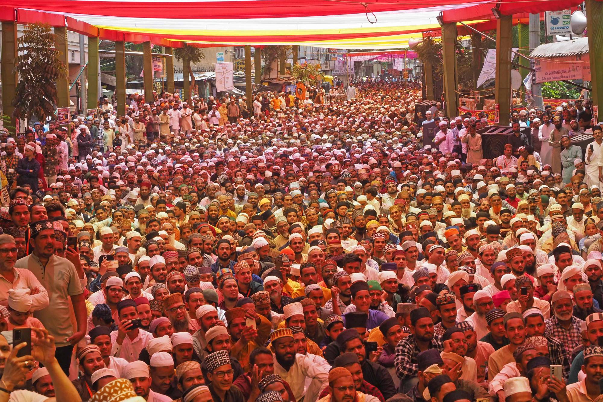 Muslims gather during a congregation in Ahmedabad on Sunday. Social media influencers from India's majority faith have cultivated large audiences by spreading false demographic data, to claim the country is being transformed into an Islamic state. | AFP-JIJI