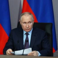 Russian President Vladimir Putin chairs a meeting on the development of unmanned aircraft, in Moscow on April 27. | SPUTNIK / MIKHAIL KLIMENTYEV / KREMLIN / VIA REUTERS