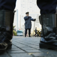 Riot policemen stand guard near the Prime Minister\'s Office in Tokyo. | KYODO
