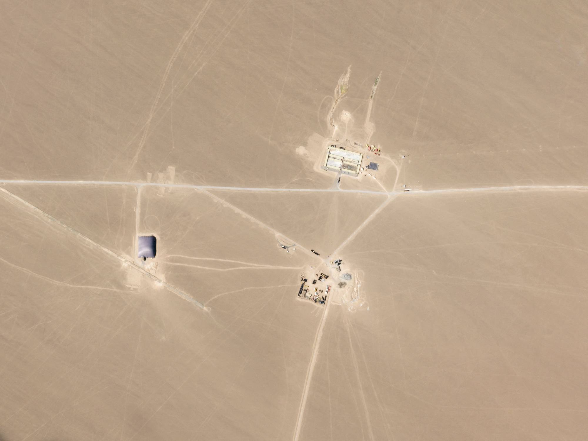 An undated image released in July 2021 shows what researchers say are missile silos under construction in the Chinese desert.   | 2021 PLANET LABS INC. / VIA AFP-JIJI