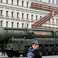 A Russian Yars intercontinental ballistic missile launcher moves along the Garden Ring road in front of a huge Z letter, a tactical insignia of Russian troops in Ukraine, toward Moscow\'s Red Square on Thursday for a rehearsal of the Victory Day military parade on May 9. | AFP-JIJI