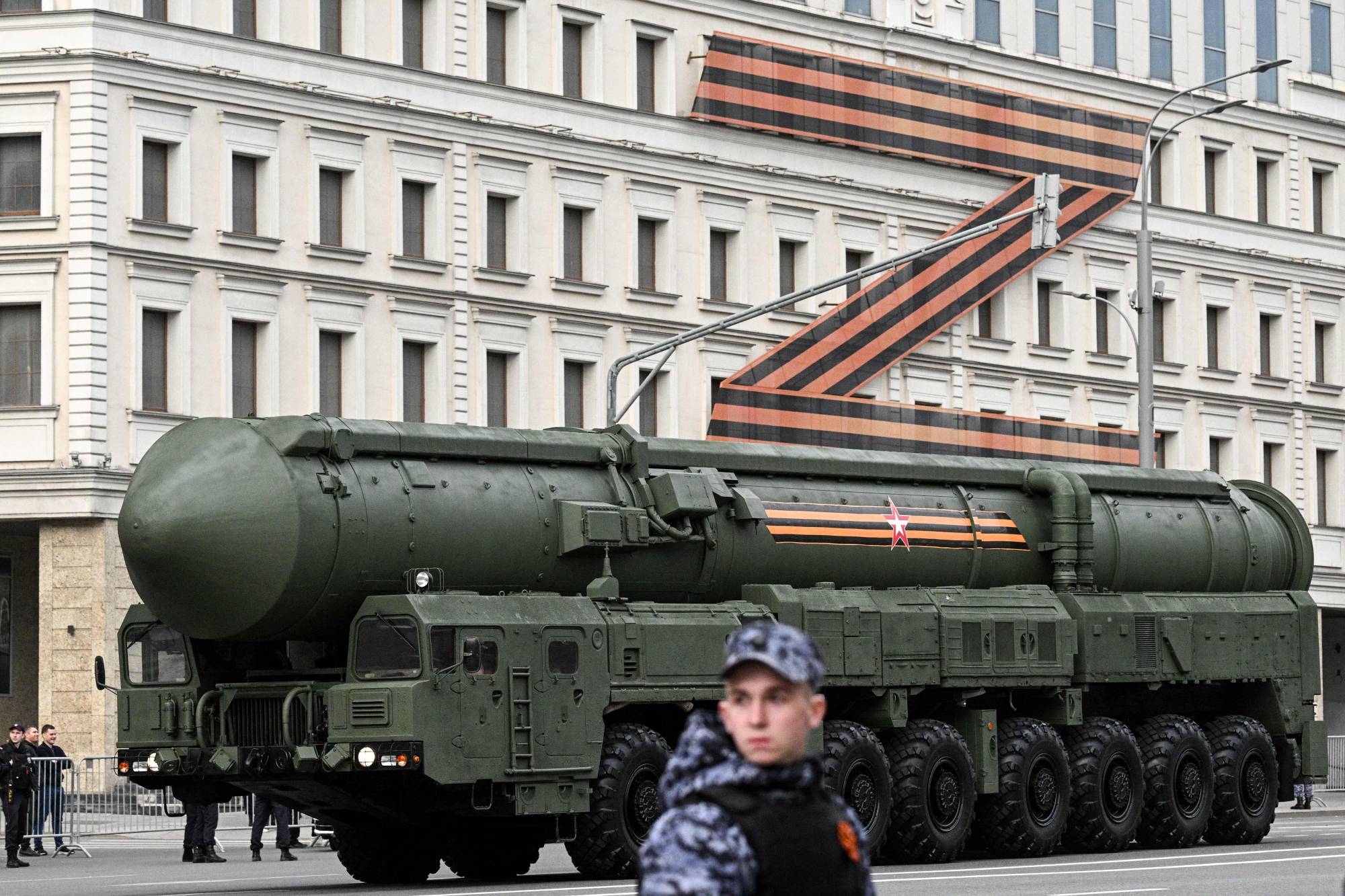 A Russian Yars intercontinental ballistic missile launcher moves along the Garden Ring road in front of a huge Z letter, a tactical insignia of Russian troops in Ukraine, toward Moscow's Red Square on Thursday for a rehearsal of the Victory Day military parade on May 9. | AFP-JIJI