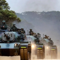 Taiwanese soldiers operate tanks during a drill at an undisclosed location on the self-ruled island on April 9.   | TAIWAN\'S MINISTRY OF NATIONAL DEFENSE / VIA AFP-JIJI