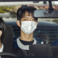 Ryuji Kimura, 24, the suspect in an attack last month on Prime Minister Fumio Kishida is taken to a police station on April 17. | KYODO