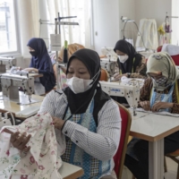 A sewing class at the Regional Vocational Training Center in West Jakarta. Domestic workers who are hired directly by a household, and who account for roughly 40% of such staff in Indonesia, are not covered at all by a new bill intended to bolster employment protections in the sector. | BLOOMBERG