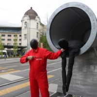 Climate protestors demonstrate against Swiss National Bank investments in the East African Crude Oil Pipeline, ahead of the bank\'s annual general meeting in Bern, Switzerland, on April 28 | BLOOMBERG
