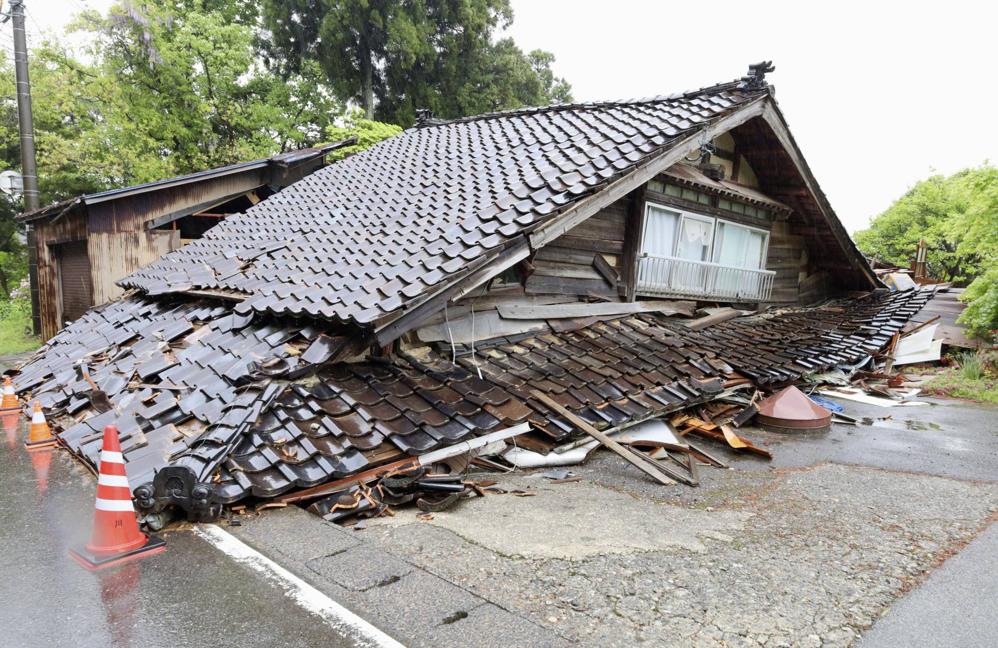 A collapsed house in Suzu, Ishikawa Prefecture, on Sunday, after a powerful quake hit the area on Friday | KYODO