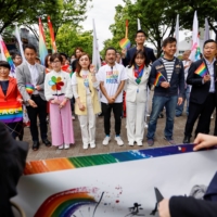 People march in the Tokyo Rainbow Pride parade in Tokyo on April 23 to celebrate advances in LGBTQ rights and call for marriage equality. REUTERS | REUTERS