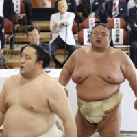 Ozeki Takakeisho (right) will need eight wins at the Summer Grand Sumo Tournament in order to maintain his rank. | JAPAN SUMO ASSOCIATION