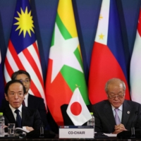 Finance Minister Shunichi Suzuki (right) and Bank of Japan Gov. Kazuo Ueda attend the 26th ASEAN+3 finance ministers and central bank governors meeting in Incheon, South Korea, on May 2. | REUTERS