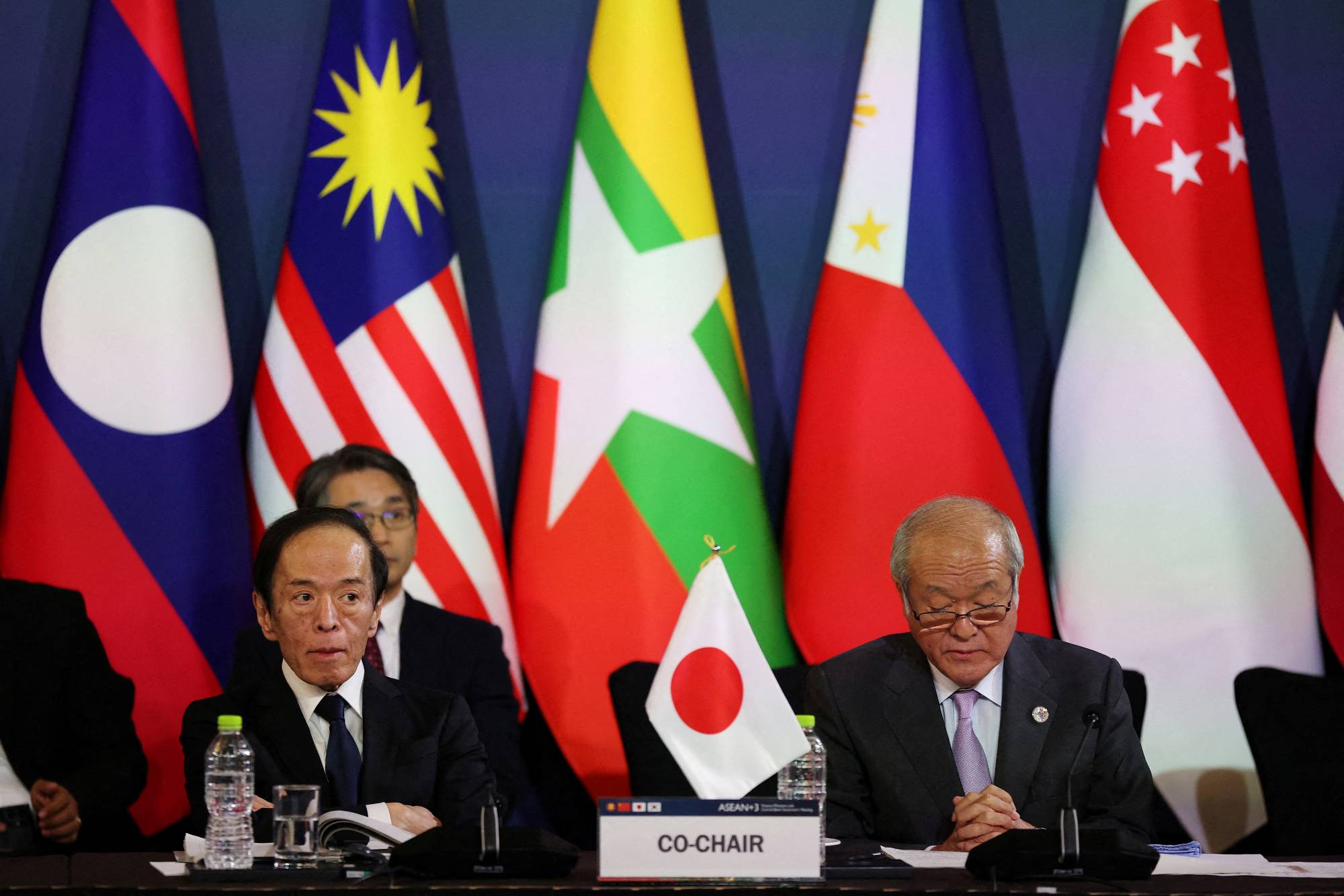 Finance Minister Shunichi Suzuki (right) and Bank of Japan Gov. Kazuo Ueda attend the 26th ASEAN+3 finance ministers and central bank governors meeting in Incheon, South Korea, on May 2. | REUTERS