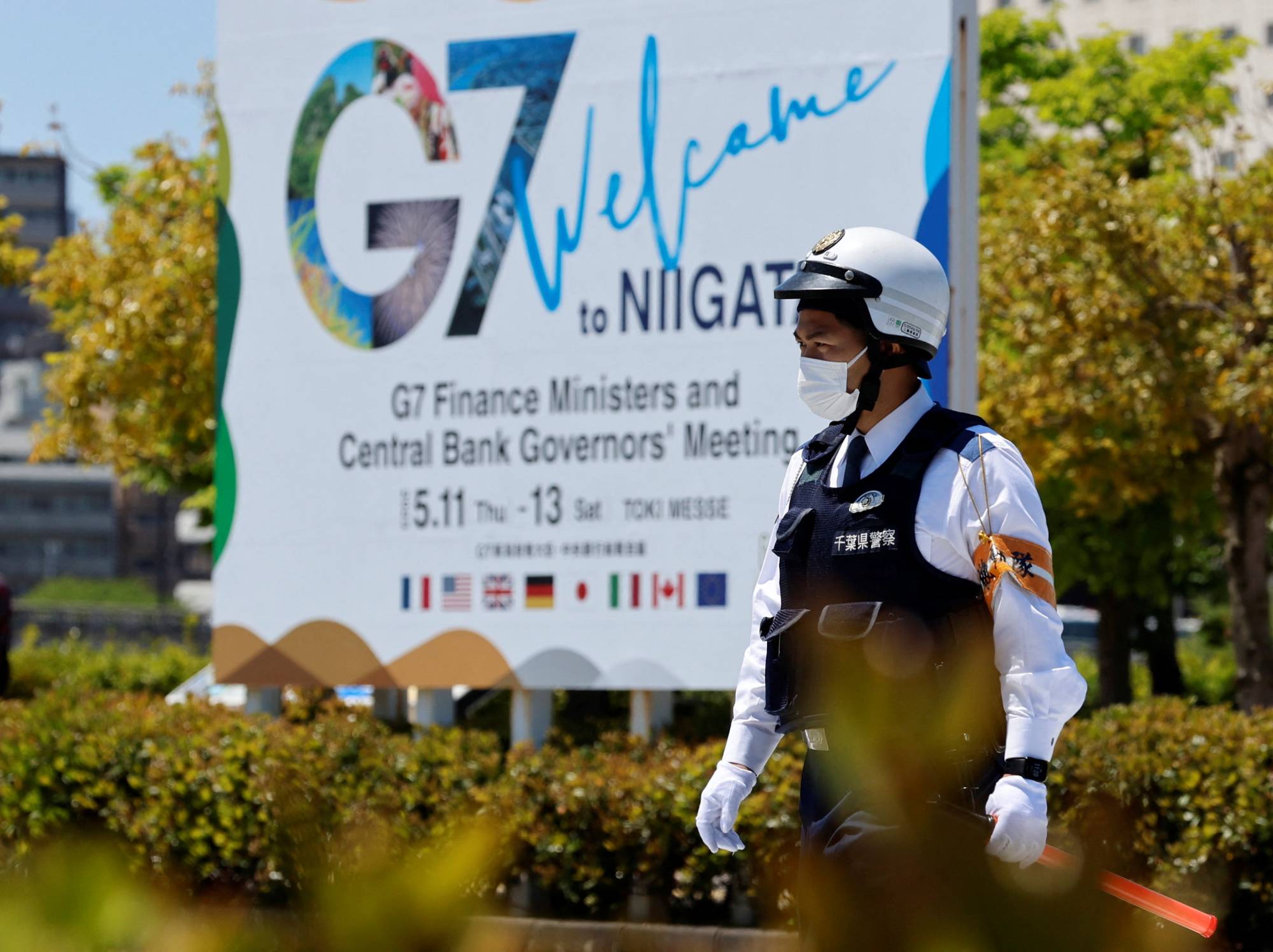 A police officer patrols an area near the venue of the G7 Finance Ministers and Central Bank Governors' meeting in Niigata on Thursday. | REUTERS