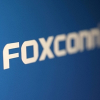 Foxconn\'s quarterly profit missed forecasts as it cited a big write-down from its stake in Sharp for the loss. | REUTERS
