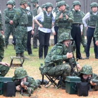 Reservists attend a training session during a visit by Taiwan\'s President Tsai Ing-wen (center-back) at a military base in Taoyuan on Thursday. | AFP-JIJI