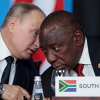 Russian leader Vladimir Putin speaks with South African President Cyril Ramaphosa at the first plenary session as part of the 2019 Russia-Africa Summit at the Sirius Park of Science and Art in Sochi, Russia, in October 2019.  | POOL / VIA REUTERS