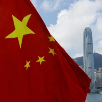 The Chinese national flag is seen in front of Hong Kong\'s Central financial district on Chinese National Day in the city last October. | REUTERS