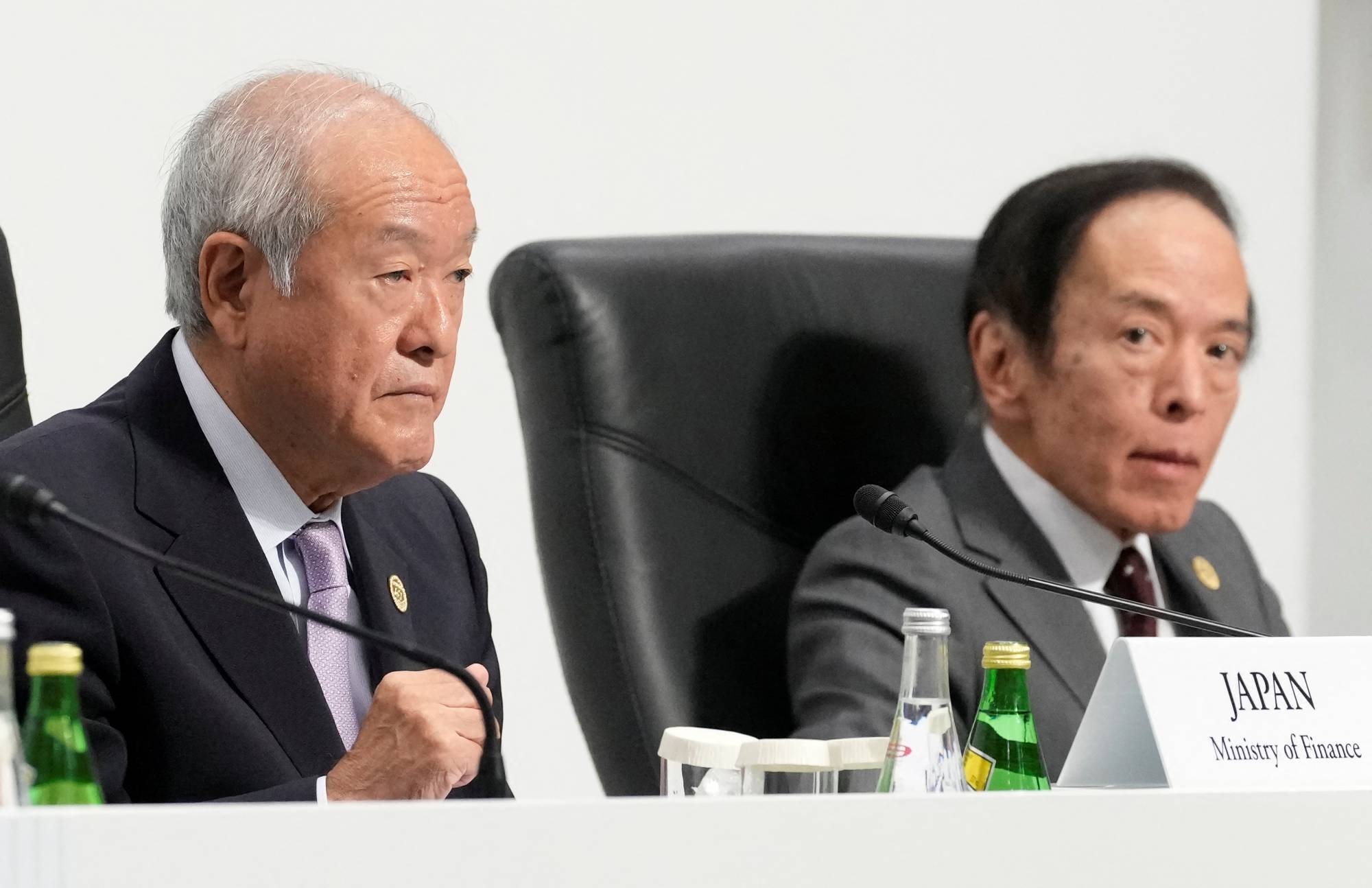Finance Minister Shunichi Suzuki (left) and Bank of Japan Gov. Kazuo Ueda attend a news conference at the conclusion of the Group of Seven finance ministers and central bank governors meeting in the city of Niigata on Saturday.  | POOL / VIA REUTERS