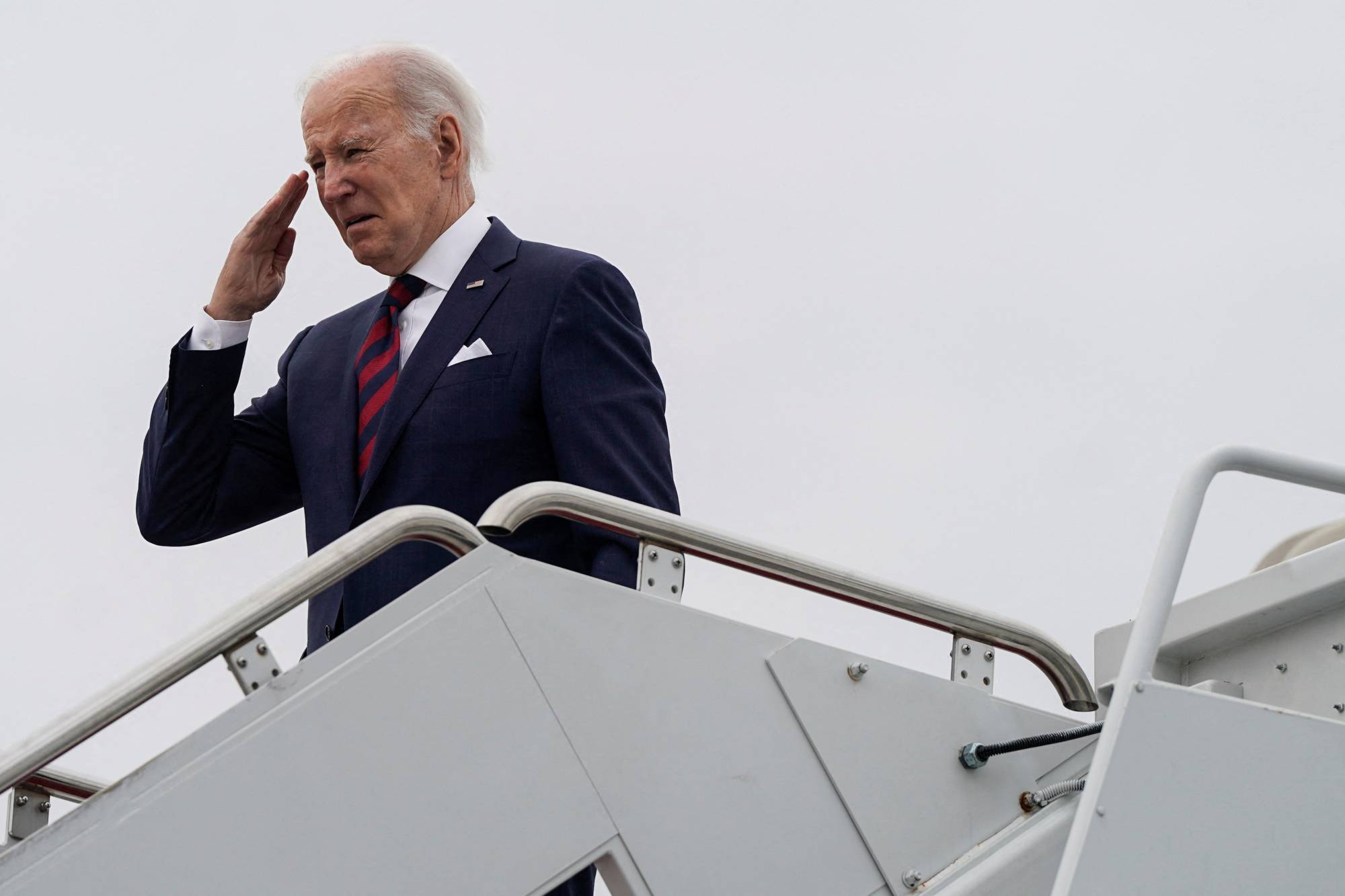 U.S. President Joe Biden boards Air Force One as he departs for Dover, Delaware, from Joint Base Andrews in Maryland on Saturday. | REUTERS