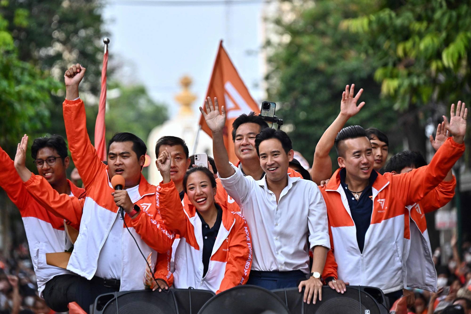 Move Forward Party leader and prime ministerial candidate Pita Limjaroenrat leads a victory parade with fellow party members and supporters on Monday. | AFP-JIJI