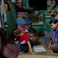 Piyu Haldar and her son, Yasir, at home in New Delhi | BLOOMBERG