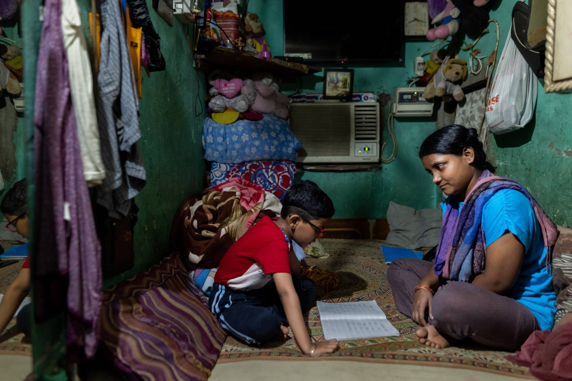 Piyu Haldar and her son, Yasir, at home in New Delhi | Bloomberg