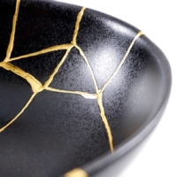 <i>Kintsugi</i> is a technique for mending broken pottery with melted gold. | GETTY IMAGES