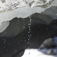 Ice melts at the Mont Mine glacier in Ferpecle near Evolene, Switzerland, in August 2022. | REUTERS


ICE MELTS INTO WATER AT THE MONT MINE GLACIER IN FERPECL