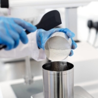 Robert Bogdan, head of manufacturing, makes a skin care product at 5 Squirrels, a skin care company, in Hove, England. | REUTERS