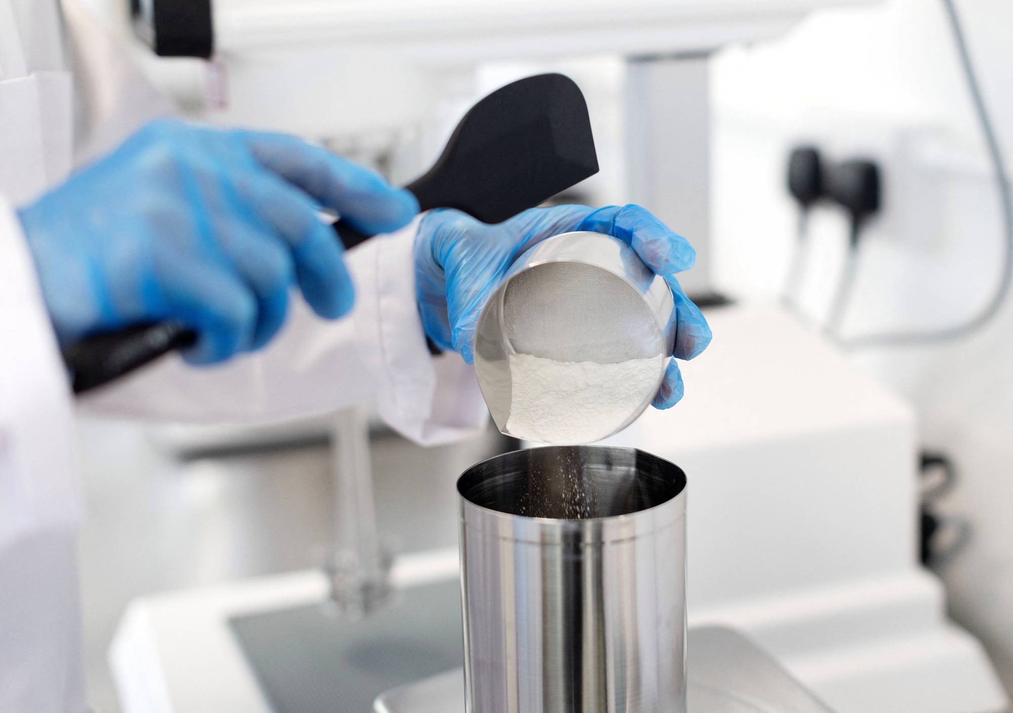 Robert Bogdan, head of manufacturing, makes a skin care product at 5 Squirrels, a skin care company, in Hove, England. | REUTERS