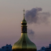 Smoke rises after a Russian missile strike in Kyiv. | REUTERS