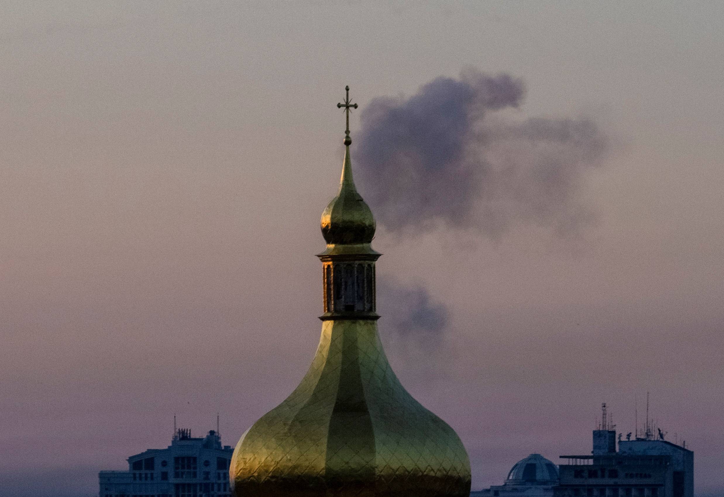 Smoke rises after a Russian missile strike in Kyiv. | REUTERS