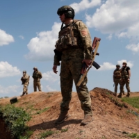 Ukrainian servicemen of the 128th territorial defense brigade attend military training in the Donetsk region, Ukraine, on Thursday. | REUTERS