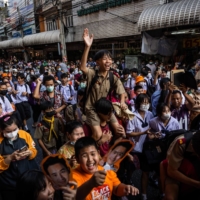 Supporters cheer for Pita Limjaroenrat in Nonthaburi, Thailand, on Thursday. | LAUREN DECICCA / THE NEW YORK TIMES