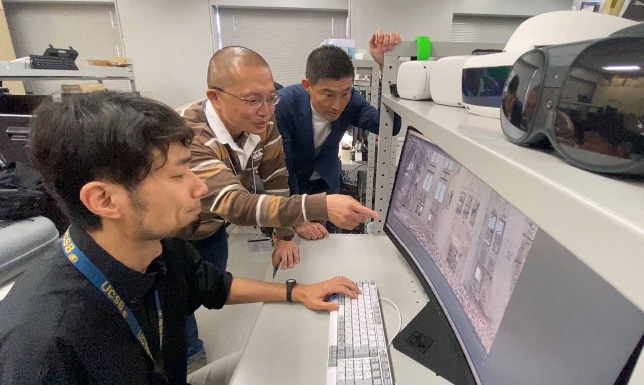 Toshiyuki Niida (center), an NHK videographer who was in charge of the VR project, works with colleagues on re-creating the Atomic Bomb Dome in virtual reality. | COURTESY OF NHK
