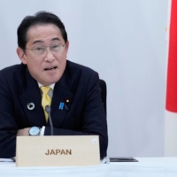 Prime Minister Fumio Kishida speaks during a G7 session on Saturday in Hiroshima.  | POOL / VIA REUTERS  