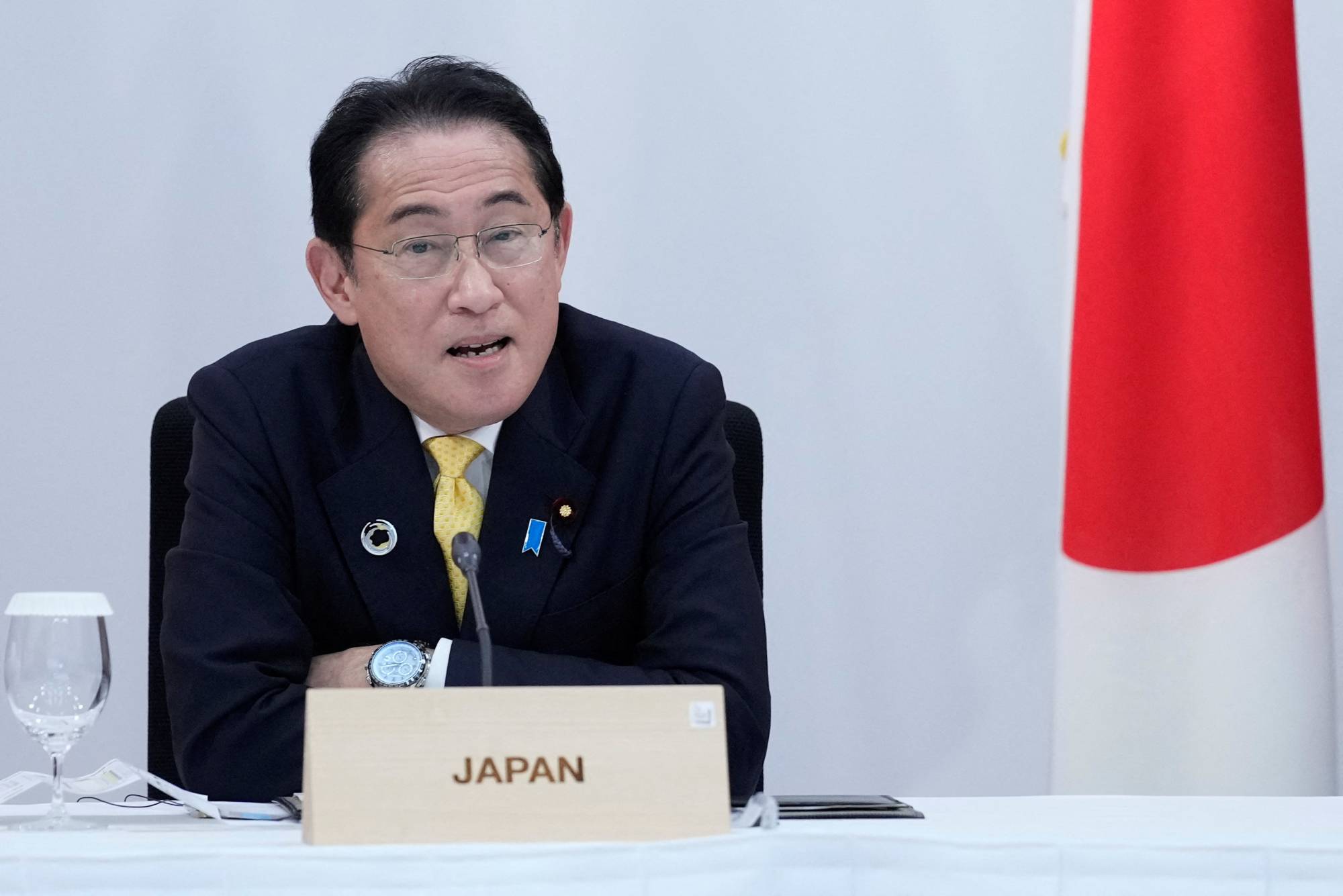 Prime Minister Fumio Kishida speaks during a G7 session on Saturday in Hiroshima. | Pool / via Reuters 