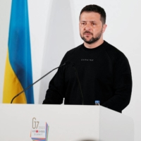 Ukrainian President Volodymyr Zelenskyy speaks during a news conference in Hiroshima on Sunday.  | REUTERS 