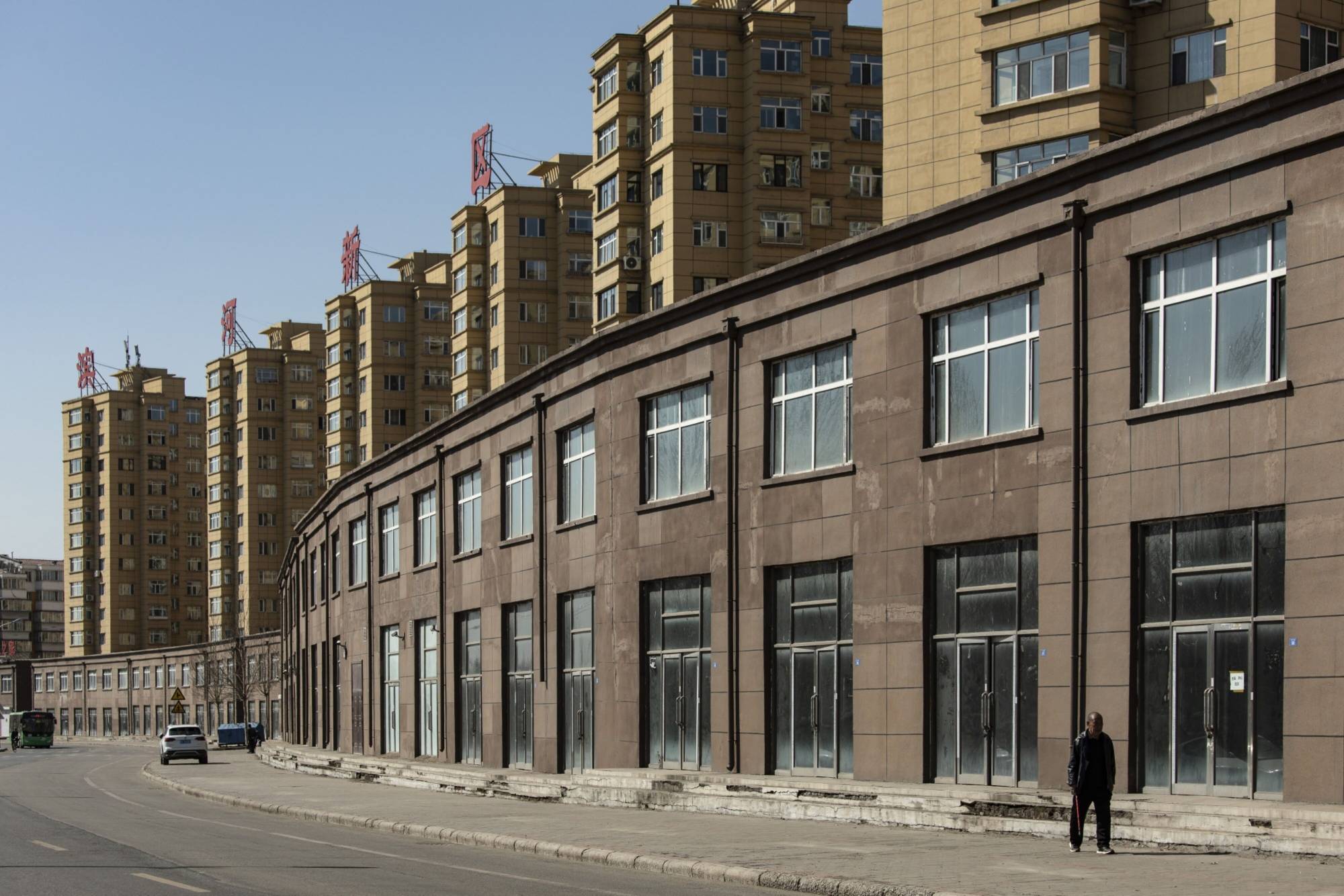 A line of empty shops in Hegang, on March 31. The heavily indebted city was forced to undergo unprecedented financial restructuring.  | BLOOMBERG