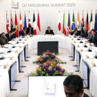 Volodymyr Zelenskyy, Ukraine\'s president, fourth from left, sits with the Group of Seven leaders and outreach countries prior to a session during the G7 leaders summit in Hiroshima, on Sunday | BLOOMBERG
