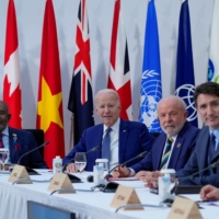 U.S. President Joe Biden (center) sits with the President of Comoros, Azali Assoumani (left), Brazil\'s President, Luiz Inacio Lula de Silva (center right), and Canadian Prime Minister Justin Trudeau, during a G7 working session on food, health and development during the G7 Summit in Hiroshima, on Saturday | POOL / VIA REUTERS
