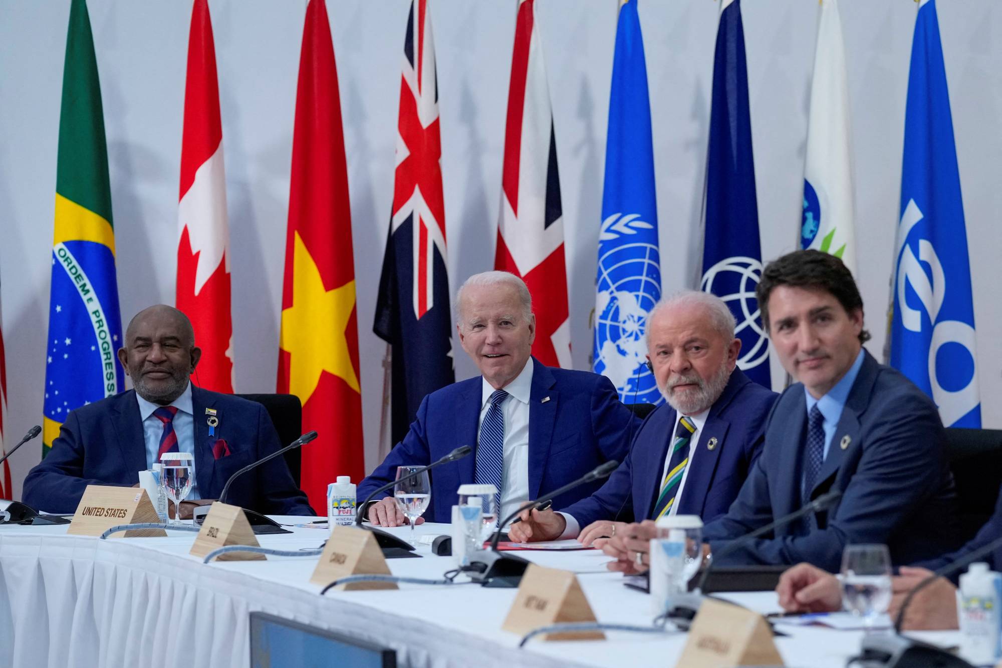 U.S. President Joe Biden (center) sits with the President of Comoros, Azali Assoumani (left), Brazil's President, Luiz Inacio Lula de Silva (center right), and Canadian Prime Minister Justin Trudeau, during a G7 working session on food, health and development during the G7 Summit in Hiroshima, on Saturday | Pool / via REUTERS 