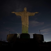 Illumination at the Christ the Redeemer statue is turned off in support of Brazilian soccer player Vinicius Jr. in Rio de Janeiro on Monday. | AFP-JIJI