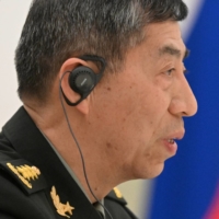 Chinese Defense Minister Li Shangfu attends a meeting with Russian President Vladimir Putin and Defense Minister Sergei Shoigu in Moscow April 16. | SPUTNIK / POOL VIA REUTERS 