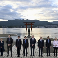 Group of Seven leaders pose for a family photo at the Itsukushima Shrine near the Hiroshima summit venue on Friday. | KENNY HOLSTON / THE NEW YORK TIMES