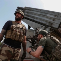 Ukrainian soldiers prepare to fire a grad multiple launch rocket system toward Russian positions near the front-line town of Bakhmut, Ukraine, on Friday.
 | RADIO FREE EUROPE / RADIO LIBERTY / VIA REUTERS 