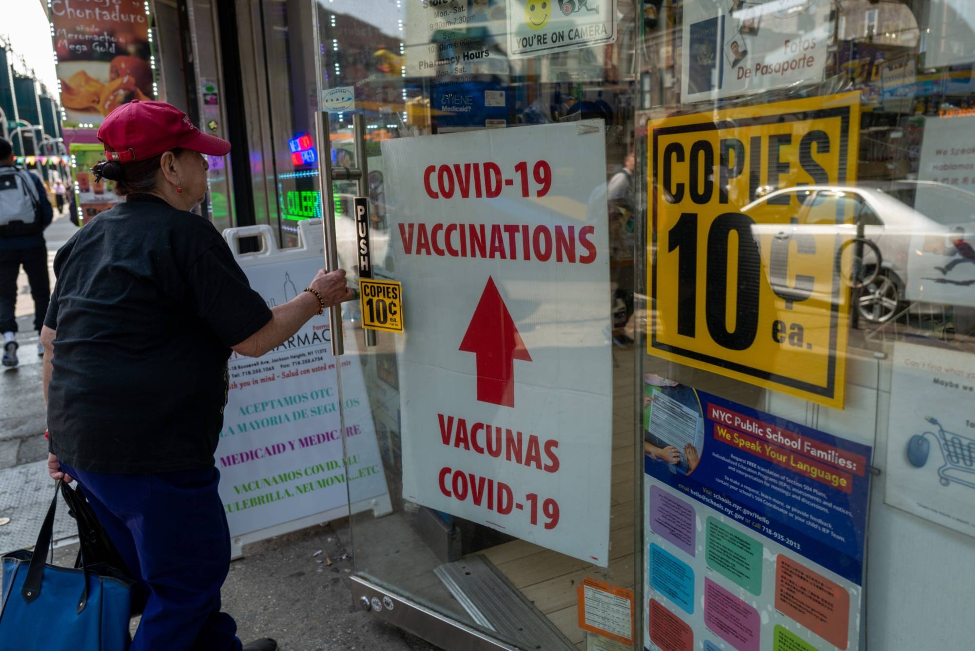 A pharmacy advertises COVID-19 vaccines in the Queens borough of New York City on May 11. | GETTY IMAGES 